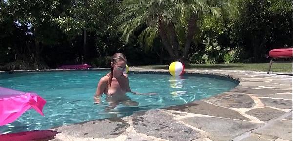  Teen whore Jonni Hennessy fingers her pussy in the pool then rides a cock hard